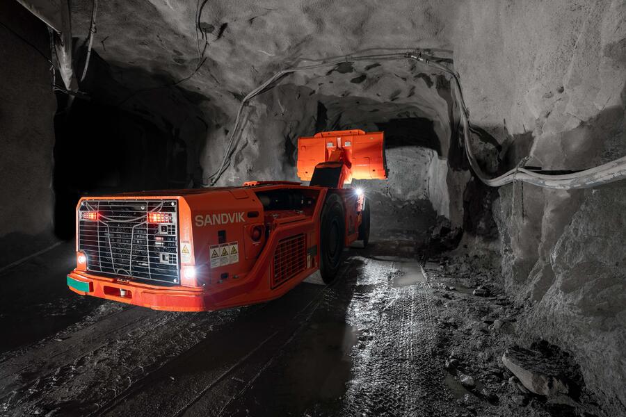 © Sandvik: A low profile loader snakes through the walls of an underground hardrock mine.