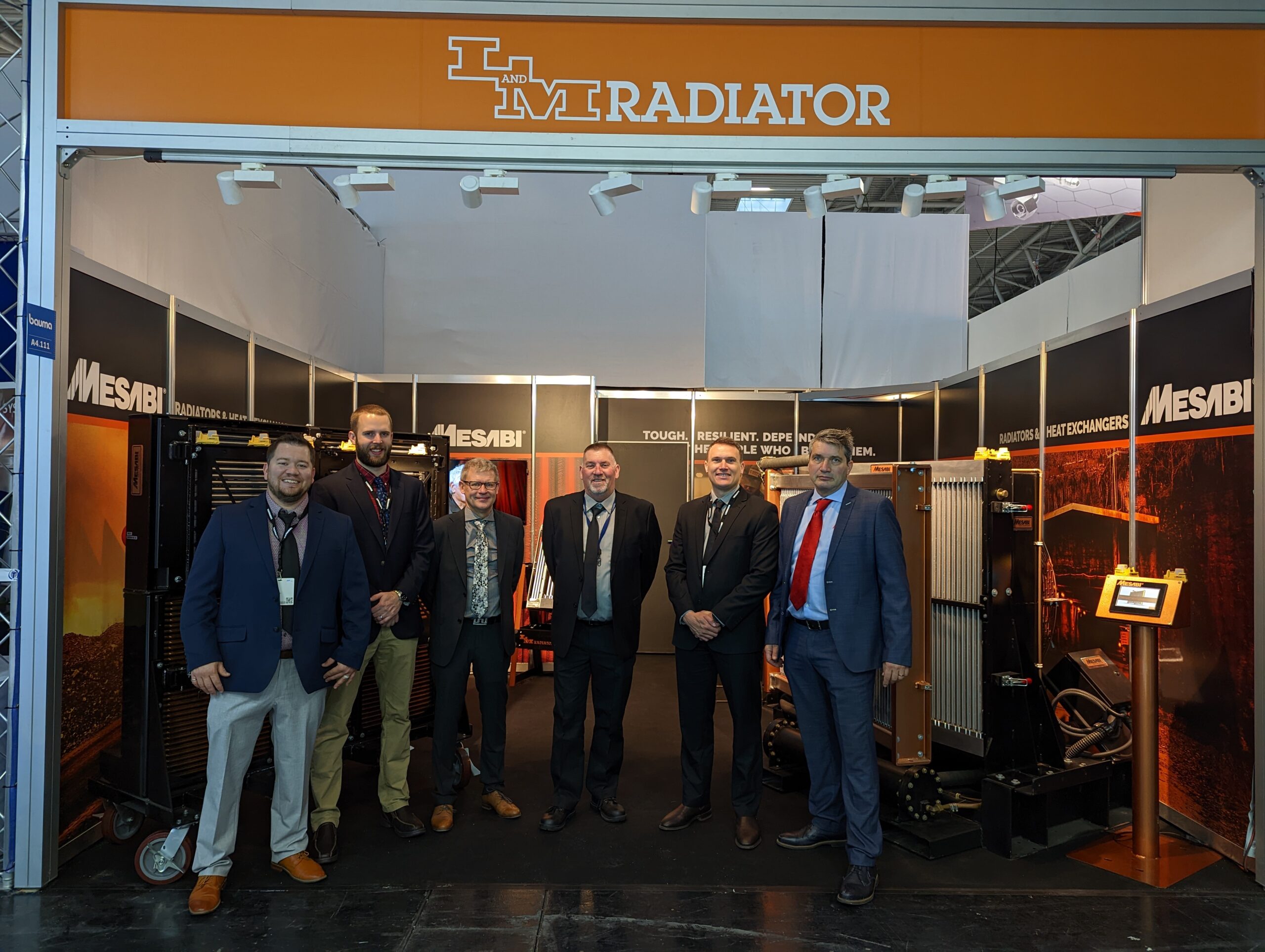 Chris Domogalla (far left) and other worldwide L&M team members at BAUMA 2022 in Munich, Germany.
