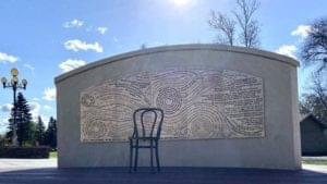 The opposite side of the wall features a series of stainless steel panels that contain lines from over 50 of Dylan’s songs